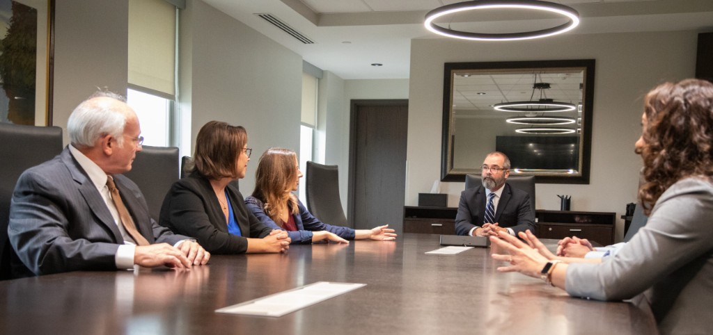 Investment advisors reviewing portfolio strategy